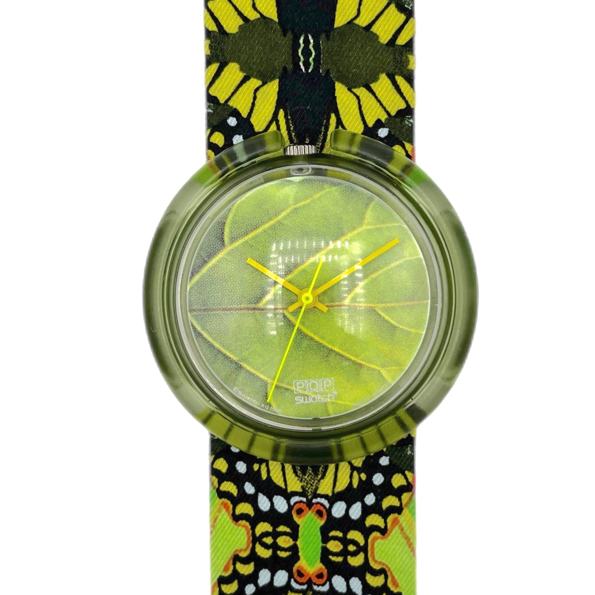 Watch with a butterfly patterned strap on a white background