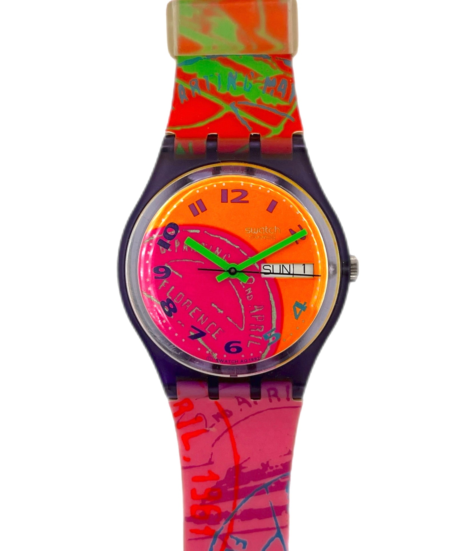 Colorful watch with a red and pink strap on a white background
