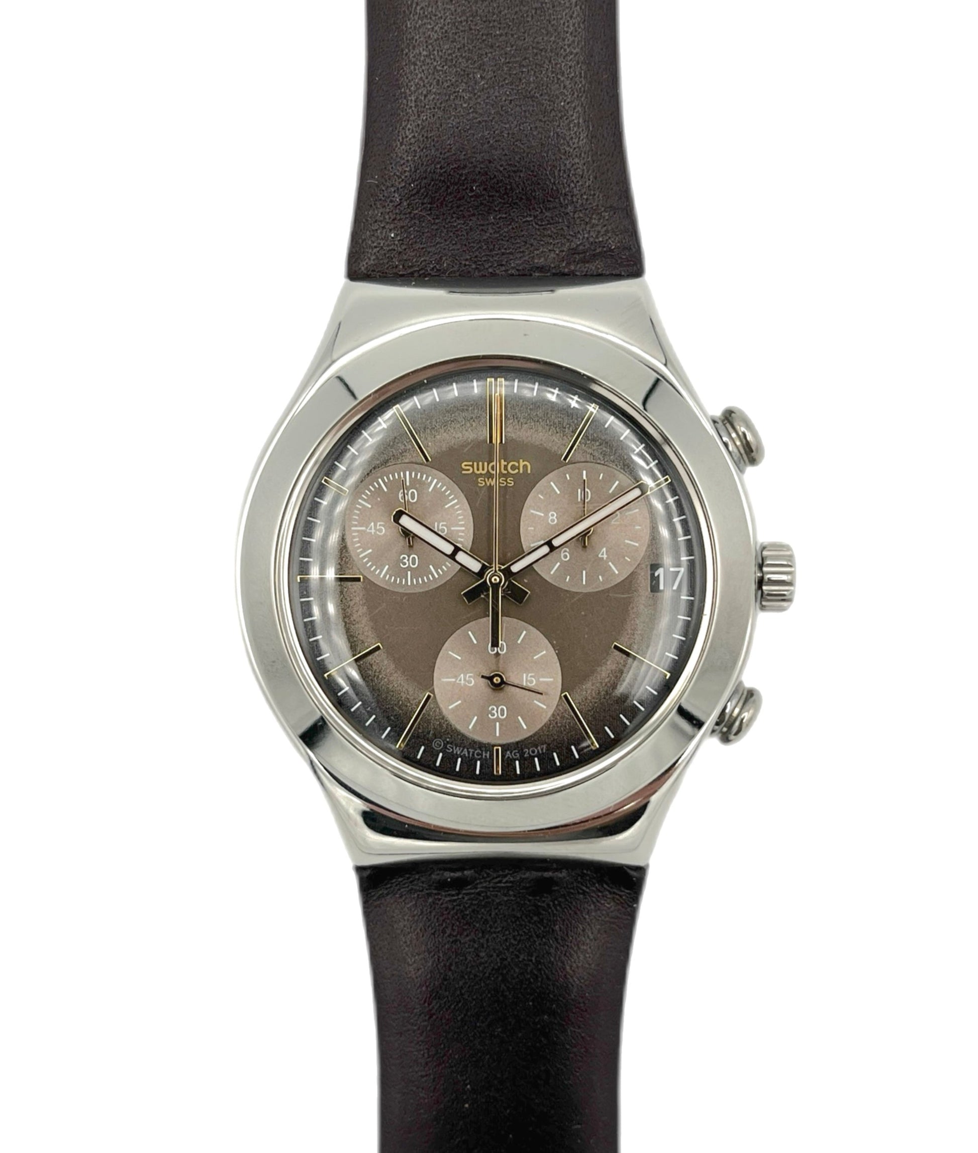 Swatch watch with black strap and brown dial on a white background