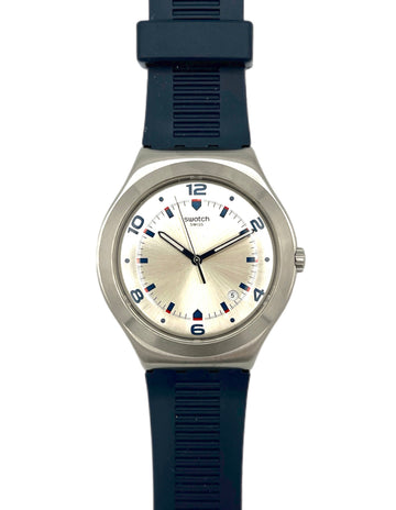 Swatch watch with blue strap and beige dial on a white background