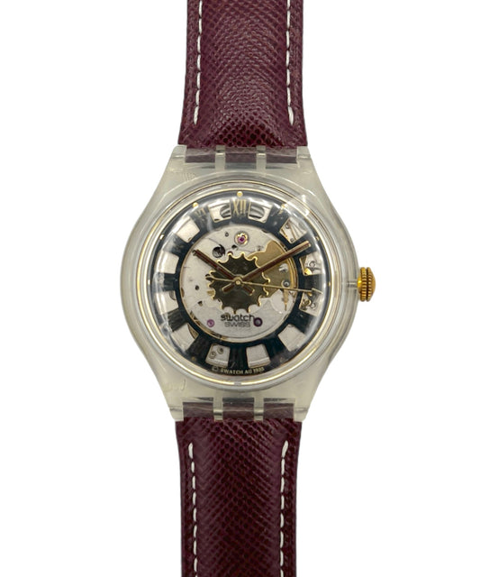 Watch with a maroon strap on a white background