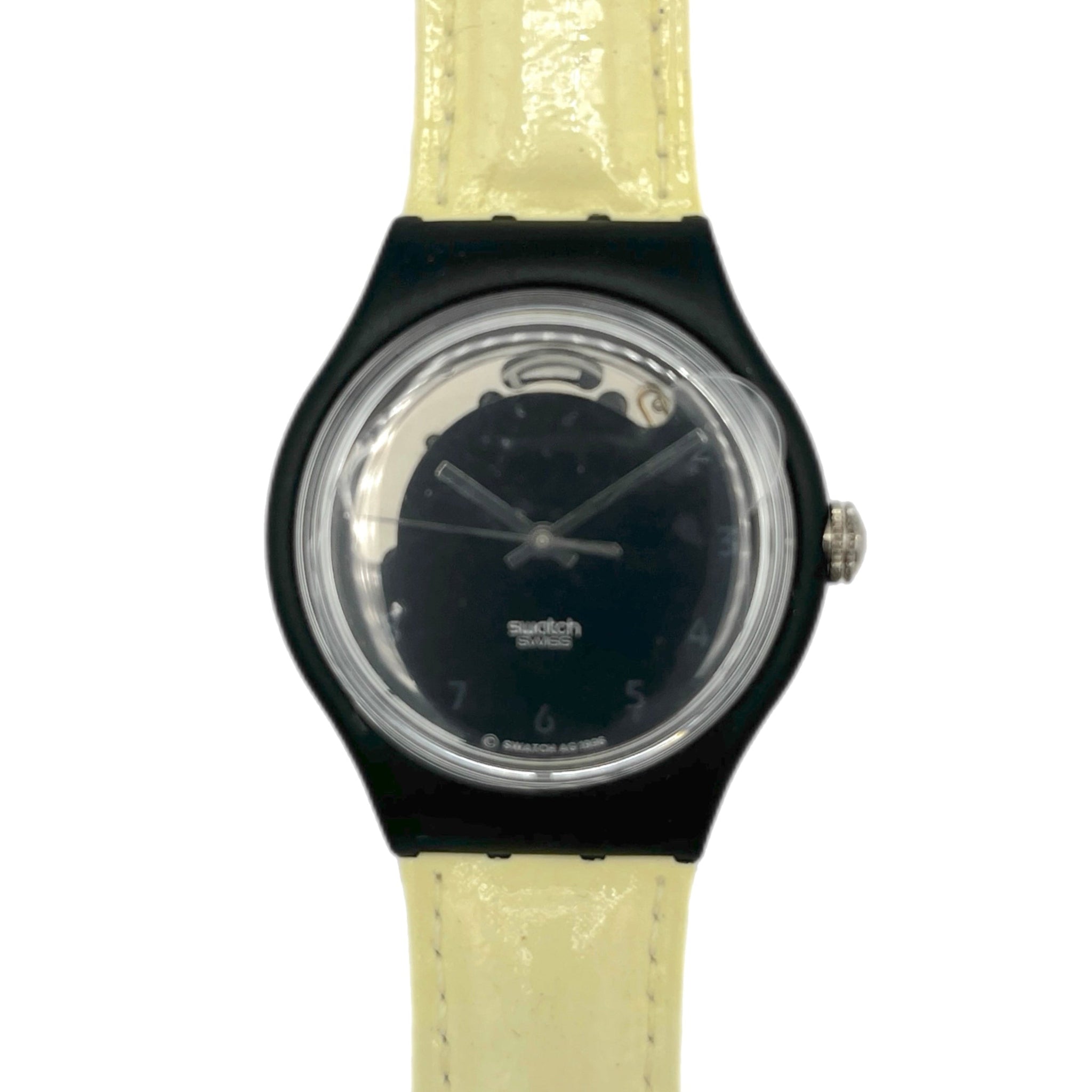 Watch with black case and beige strap on a white background