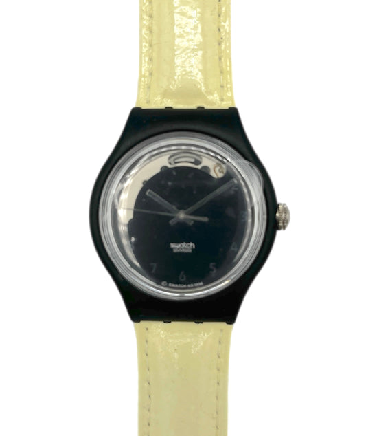 Watch with black case and beige strap on a white background