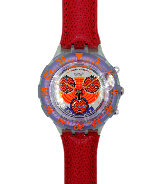 Watch with red strap and colorful face on a white background