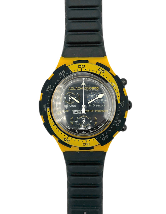 Wristwatch with black and yellow strap on a white background