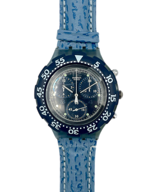 Blue watch with a textured strap on a white background