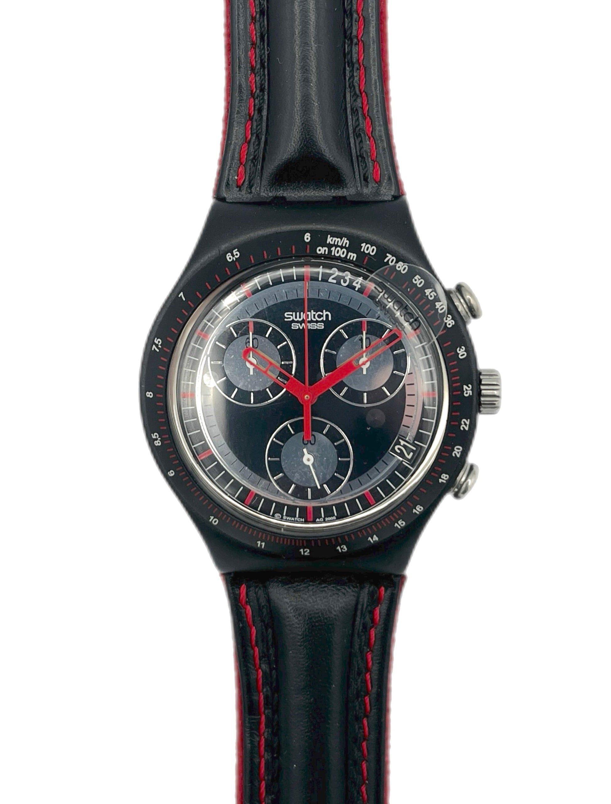 Black Swatch watch with red accents on a white background