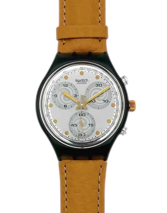 Watch with brown leather strap and silver dial on a white background
