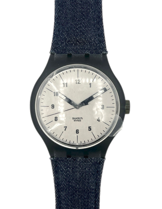 Watch with a blue denim strap on a white background