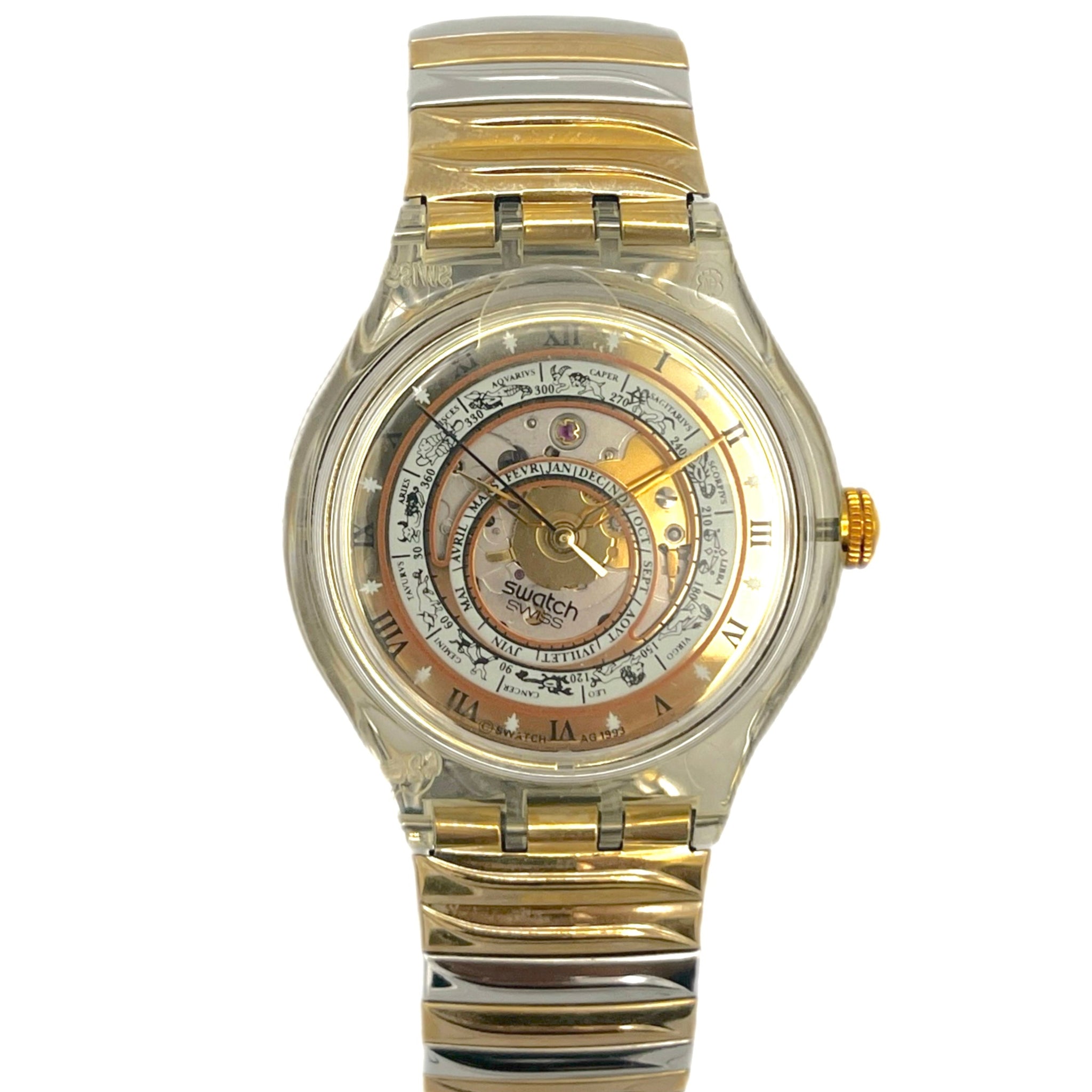Gold and silver watch with a detailed face on a white background