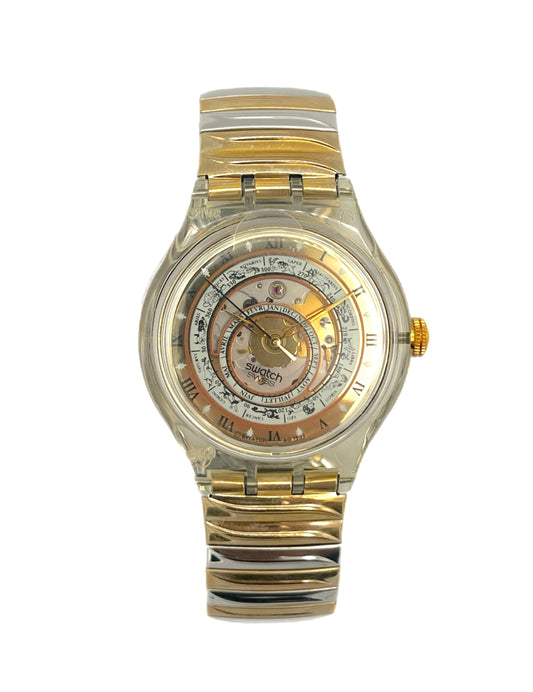 Gold and silver watch with a detailed face on a white background