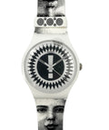 Watch with black and white patterned strap and face on a white background