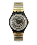 Two-tone gold and black watch with a white face on a white background