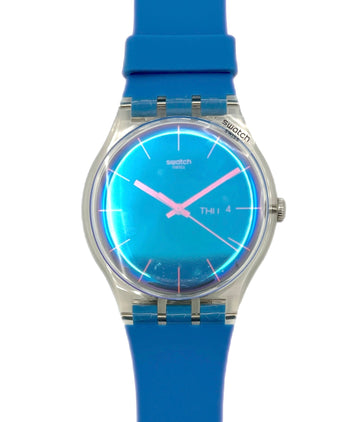Swatch watch with blue strap and blue face on a white background