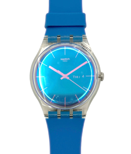 Swatch watch with blue strap and blue face on a white background