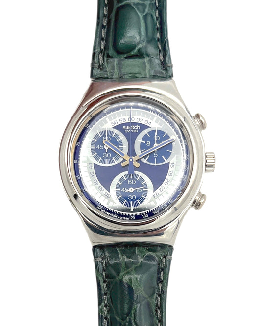 Swatch watch with green strap and blue face on a white background