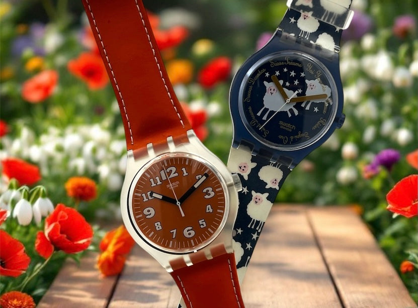 A new, unopened replacement band for a Pop Swatch watch, featuring a vibrant orange textile strap with a matching orange dial, packaged in a clear plastic case.
