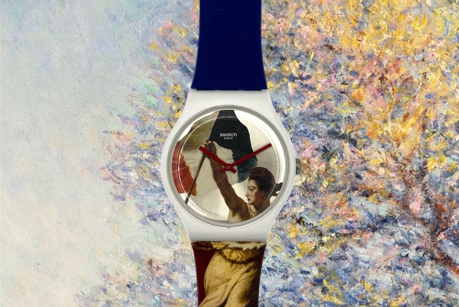 A new, unopened replacement band for a Pop Swatch watch, featuring a vibrant orange textile strap with a matching orange dial, packaged in a clear plastic case.