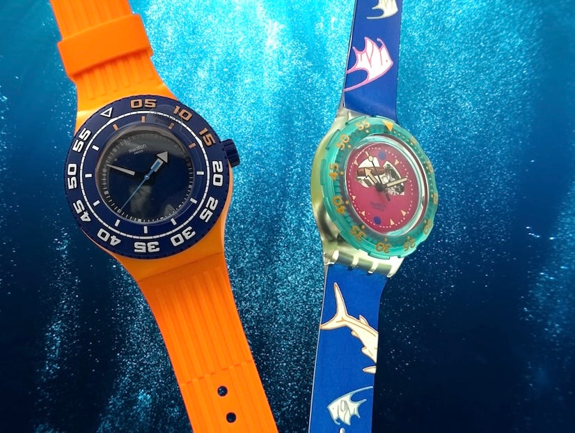 A new, unopened replacement band for a Pop Swatch watch, featuring a vibrant orange textile strap with a matching orange dial, packaged in a clear plastic case.