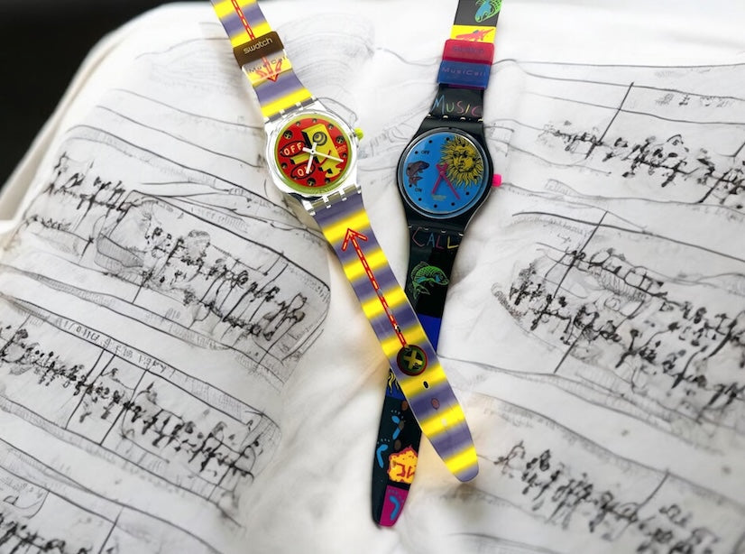 A new, unopened replacement band for a Pop Swatch watch, featuring a vibrant orange textile strap with a matching orange dial, packaged in a clear plastic case.