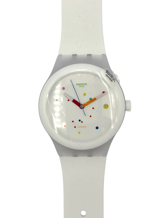 White Swatch Sistem 51 automatic watch with colorful face on a white background