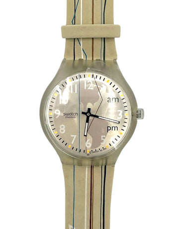Swatch watch with beige strap and light face on a white background