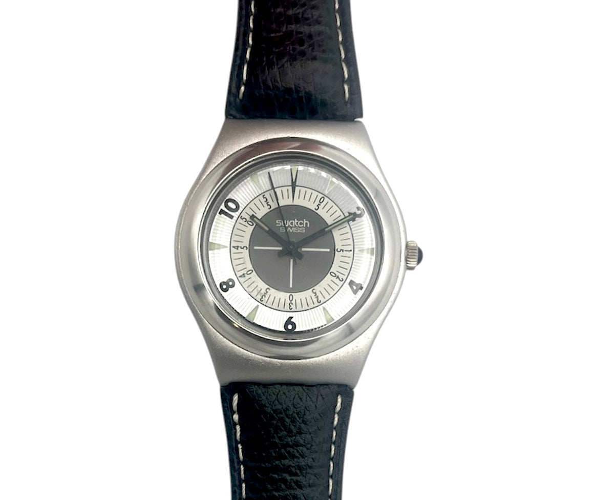 Swatch watch with black strap and silver case on a white background