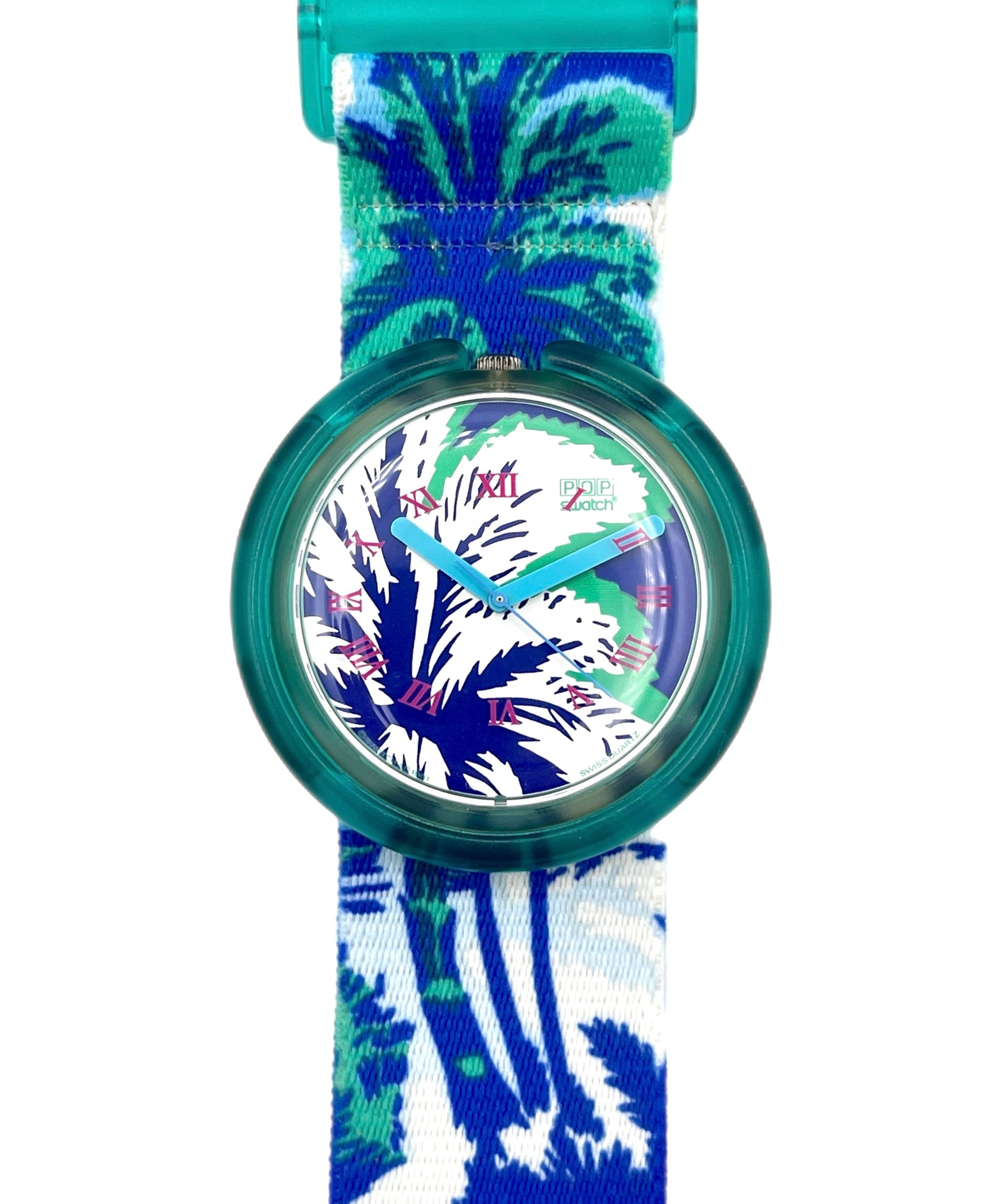 Watch with a blue and green floral strap on a white background