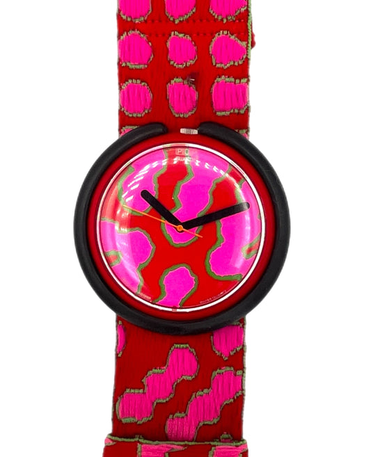 Watch with red and pink patterned strap on a white background