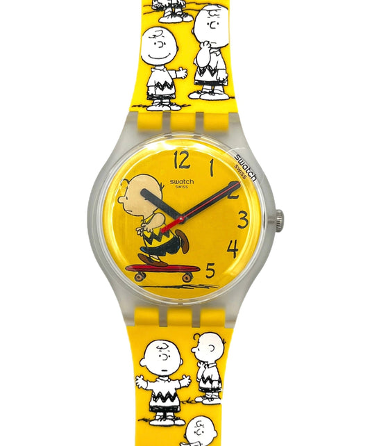 Swatch watch with Charlie Brown design on a yellow background