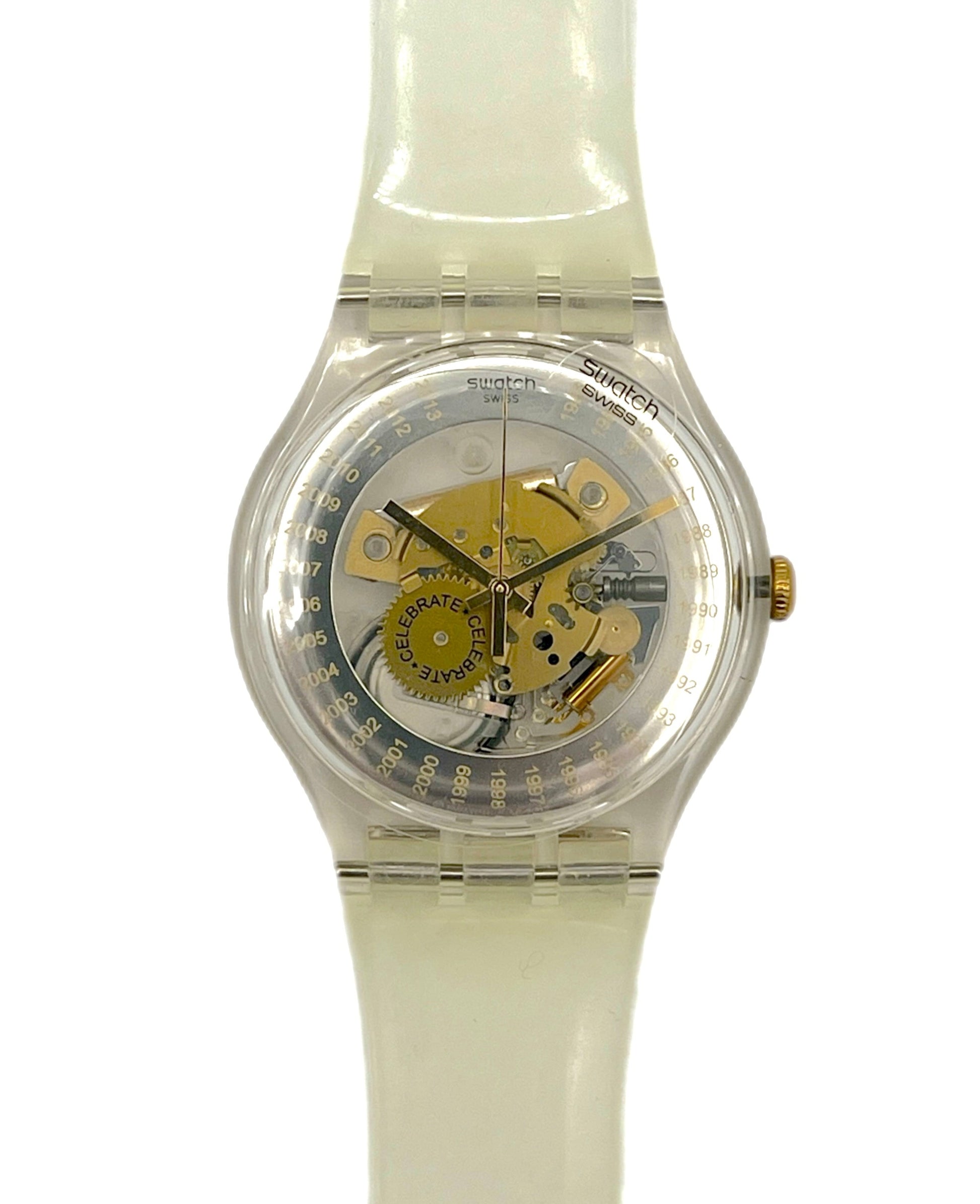 Swatch watch with a clear face and white strap on a white background