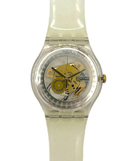 Swatch watch with a clear face and white strap on a white background