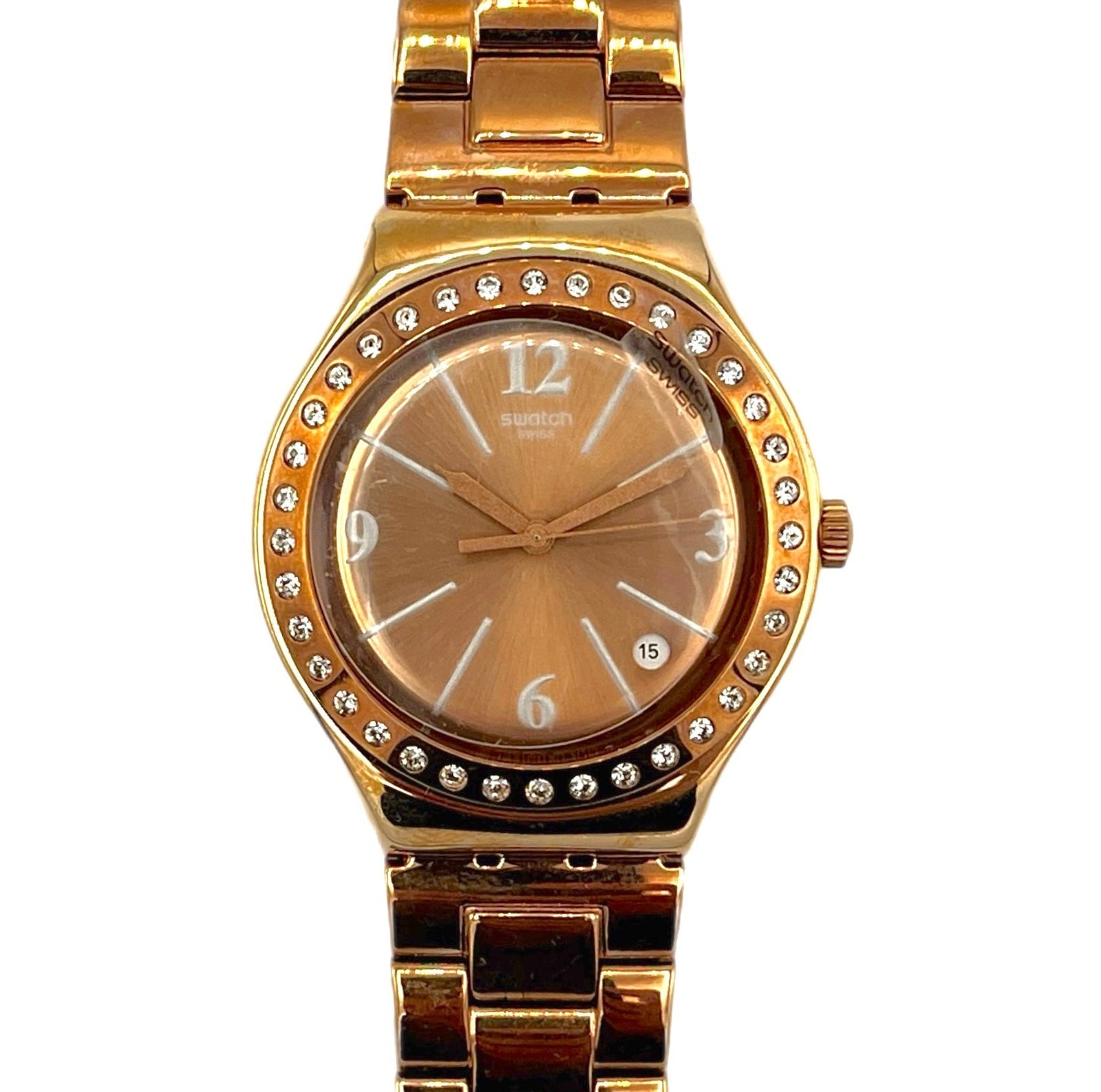 Gold watch with diamond-studded bezel on a white background