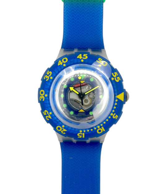 Watch with blue strap and blue dial on a white background