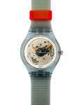 Swatch watch with a transparent case and gray strap on a white background