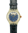 Swatch watch with blue face and black strap on a white background