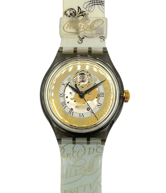 Watch with decorative strap on a white background