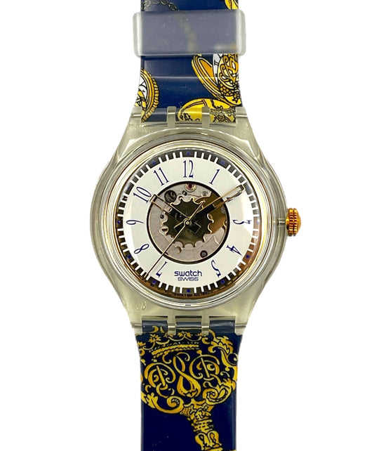 Swatch watch with blue and gold strap on a white background