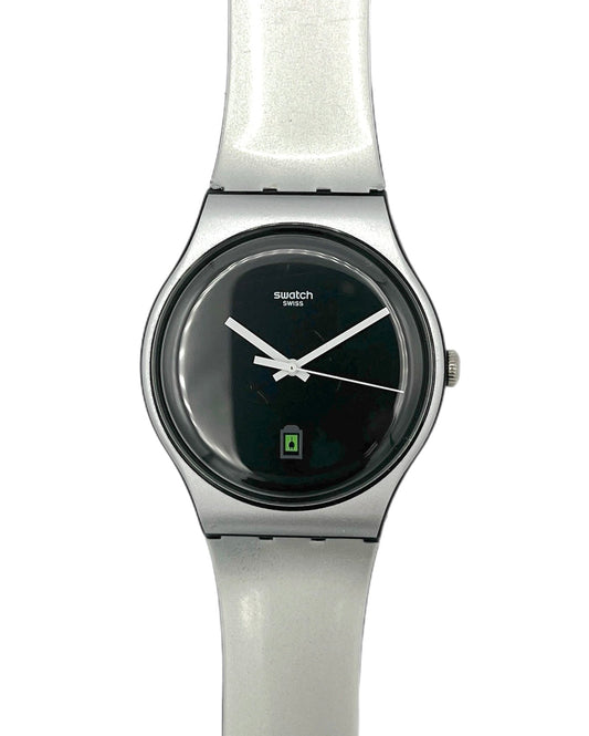 Swatch watch with black face and white strap on a white background