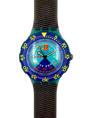 Colorful watch with a blue face and black strap on a white background