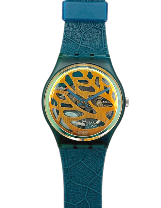 Watch with blue strap and gold face on a white background