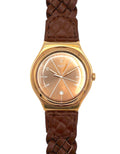 Gold watch with brown braided strap on a white background