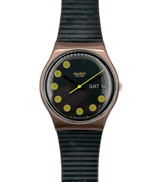 Swatch watch with black strap and black dial on a white background
