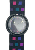 A wristwatch with a round black bezel and a dark strap featuring a colorful geometric pattern of pink, purple, and blue squares, shown against a plain white background.
