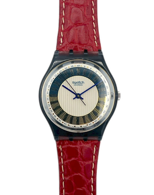 Swatch watch with a red strap on a white background
