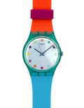 A Swatch wristwatch with a translucent teal case, a white dial decorated with colorful polka dots, and a vibrant color-blocked strap in orange, magenta, and light blue.