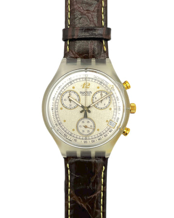 Swatch watch with brown leather strap on a white background