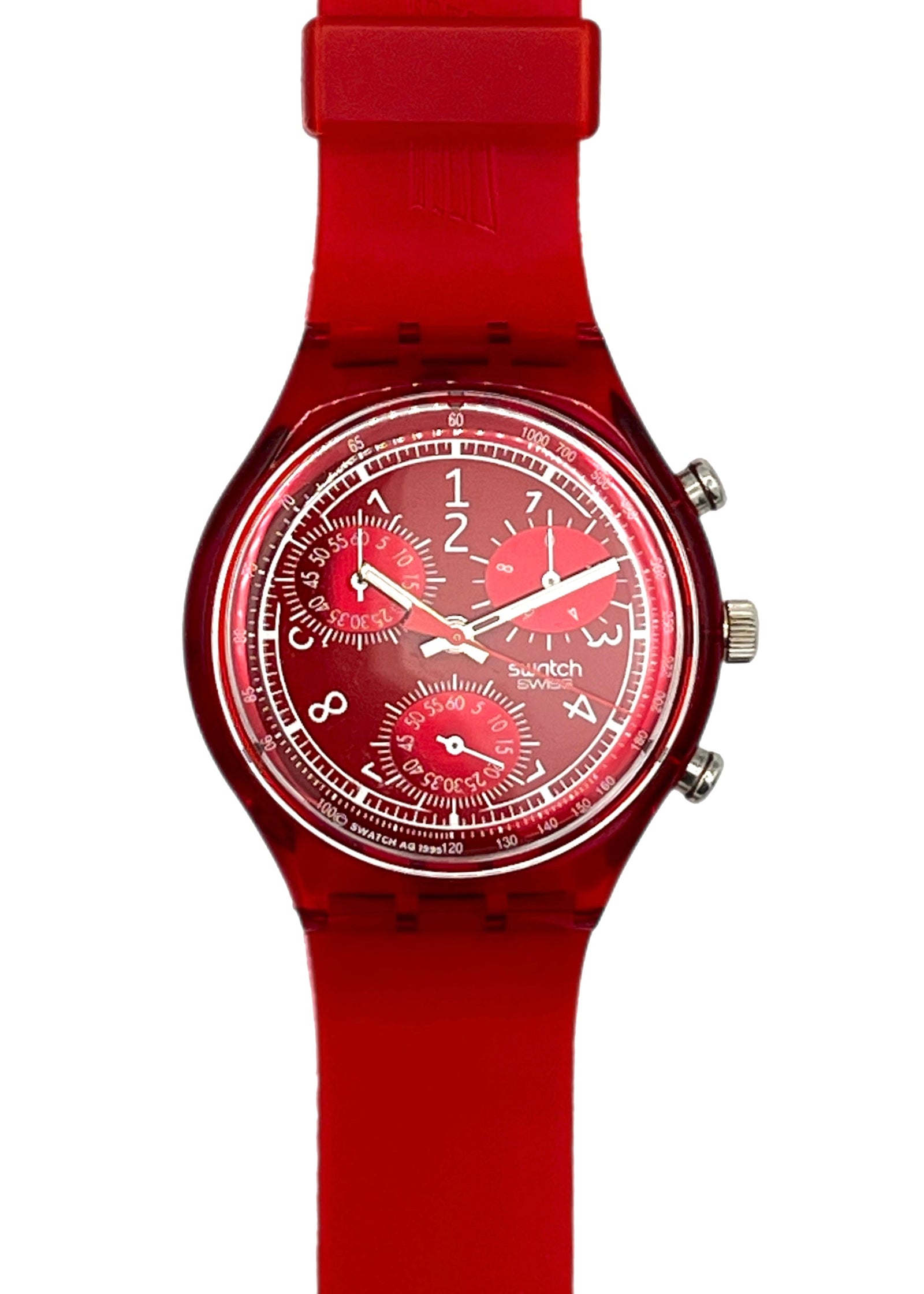 A Swatch Swatch Red analog watch with a translucent red strap, red case, and a detailed red dial with white markings and sub-dials.