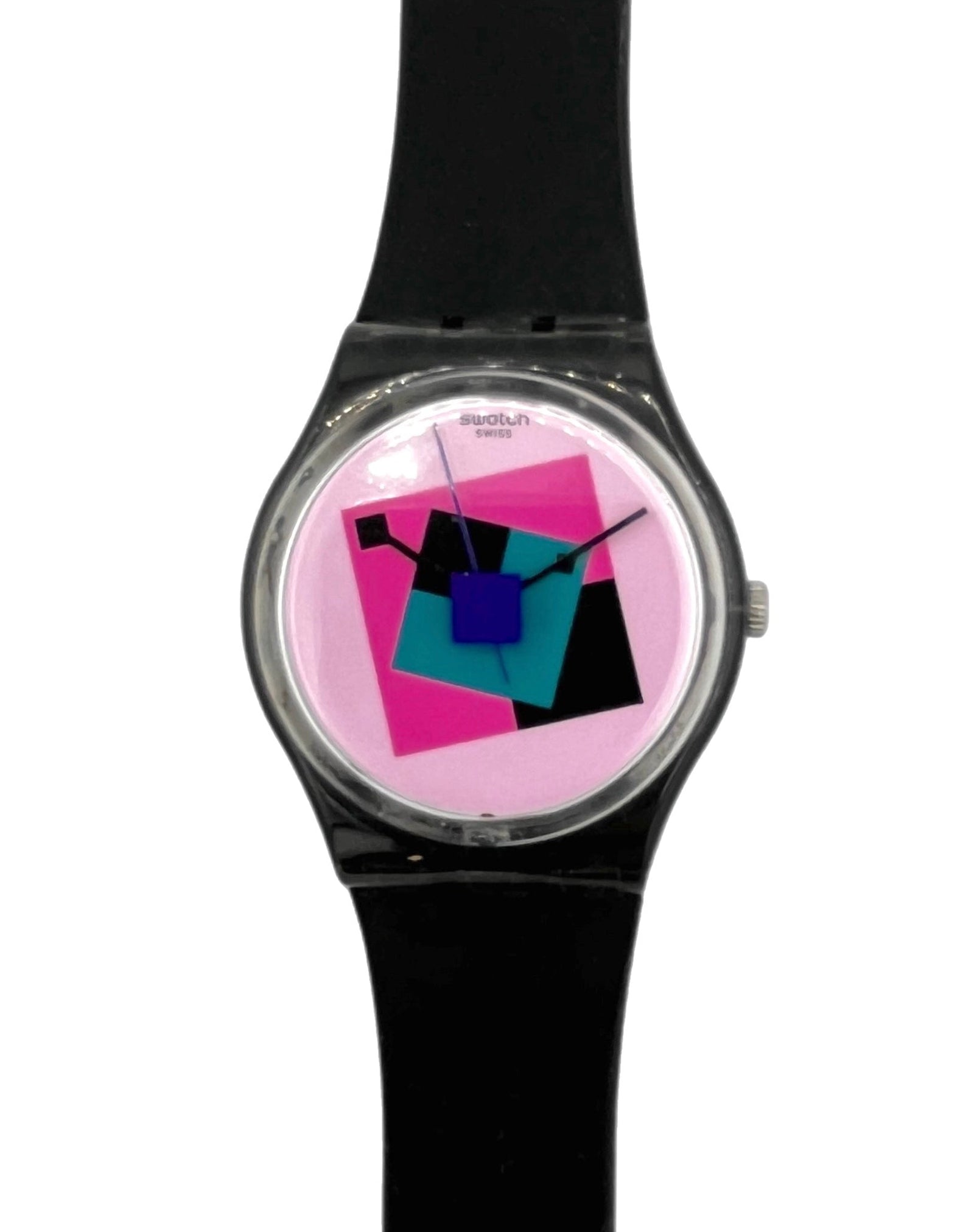 A wrist watch with a black strap and a round silver-tone case, featuring a colorful geometric dial with pink, blue, and black shapes on a light background.