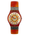 Wristwatch with decorative face and band on a white background